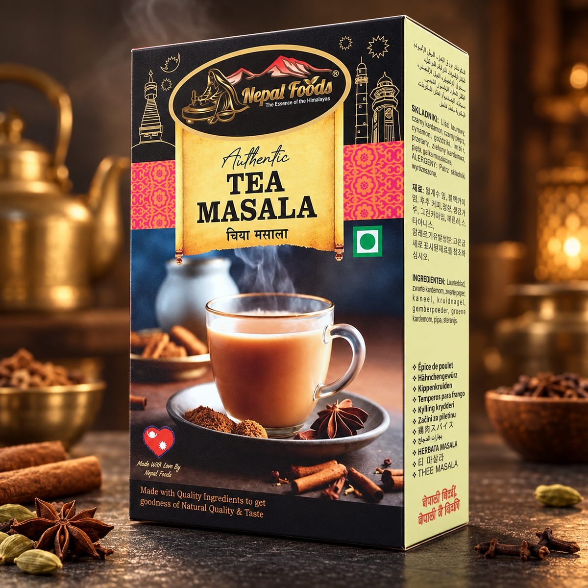 A box of Nepal Foods Authentic Tea Masala is shown standing upright on a dark surface with warm, blurred spices and a teapot in the background. The packaging features a golden scroll design, red patterned bands, and an image of a cup of tea with cinnamon and star anise.