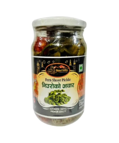 Jar of fern shoot pickle with a label on a white background
