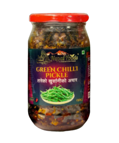 Jar of green chilli pickle with a red lid on a white background