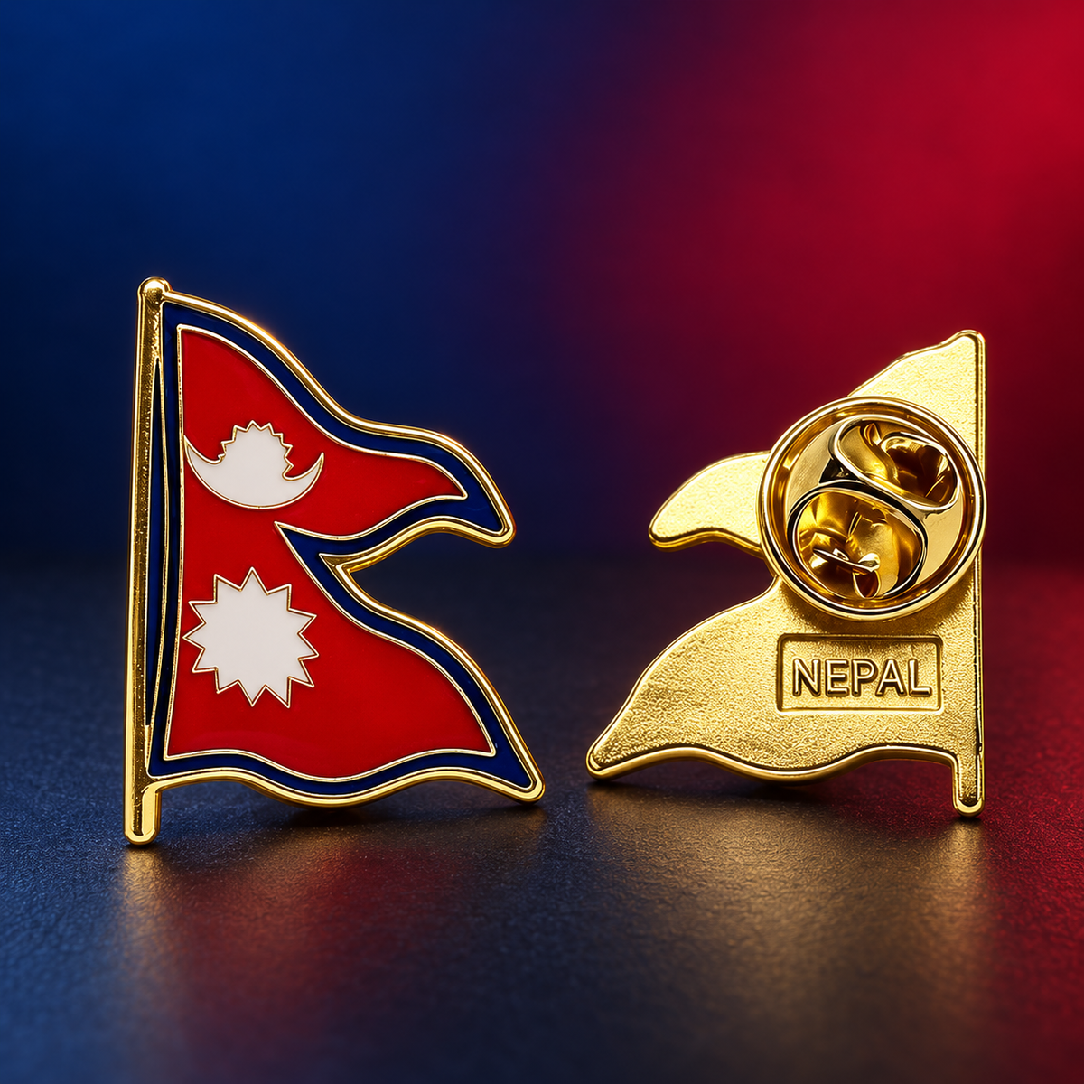 Two Nepal flag lapel pins shown on a dark reflective surface with a blue-to-red gradient background. One pin shows the front with the red, white, and blue Nepal flag design, and the other shows the gold-toned back with a pin clasp and the word NEPAL.
