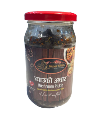 Jar of mushroom pickle with a red lid on a white background