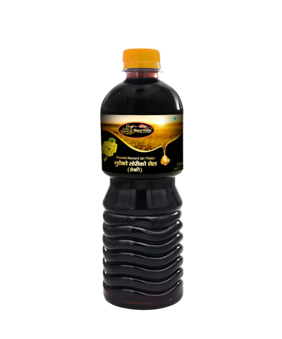 Bottle of mustard oil with a yellow cap on a white background