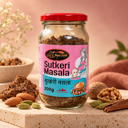 A glass jar of Nepal foods Sutkeri Masala (sugar paste) with a pink and blue label and a red lid, styled on a stone surface with almonds, cardamom, walnut, cinnamon, and a bowl of ingredients against a warm pink background.