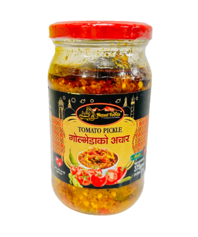 Jar of tomato pickle with a red lid on a white background