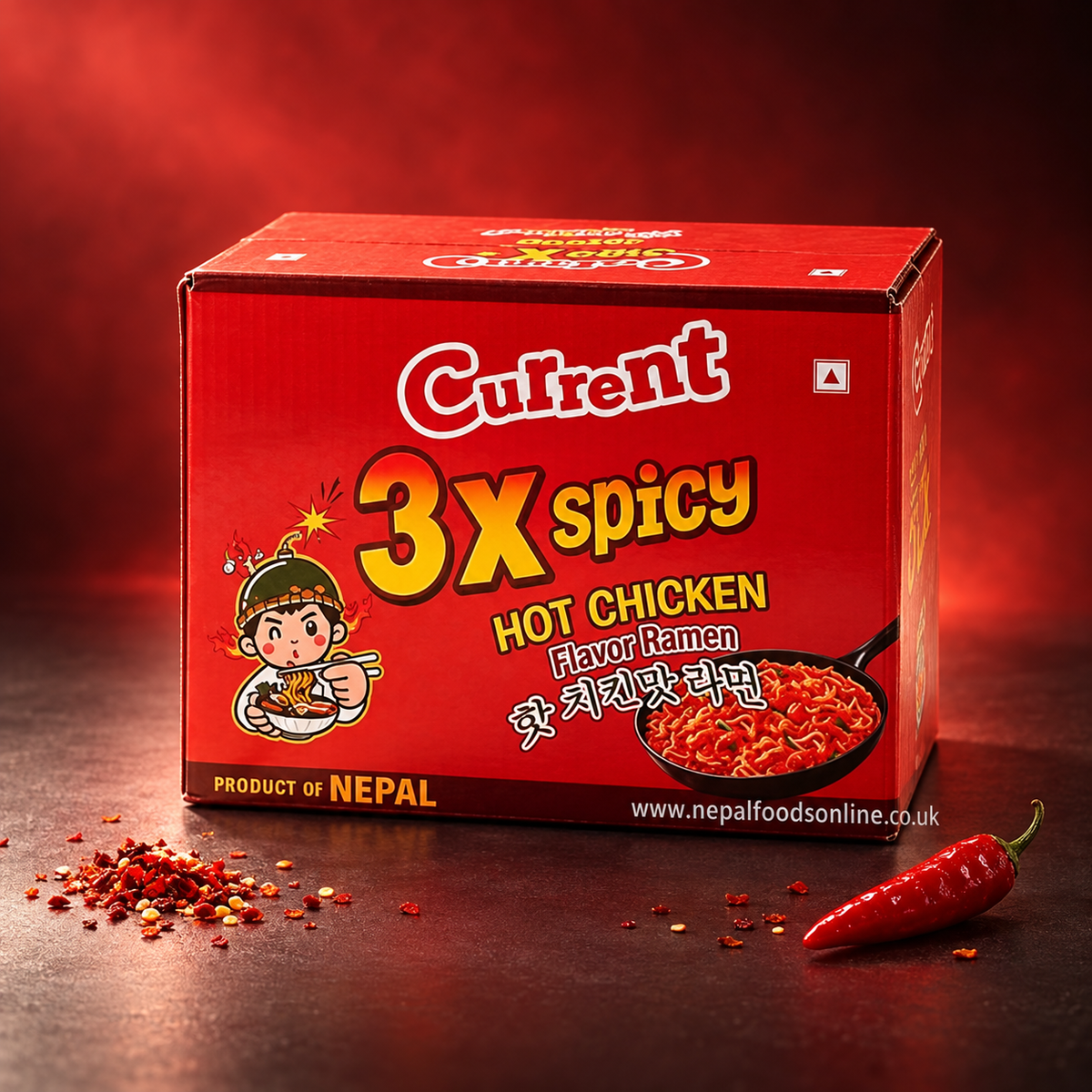 A red box of Current 3X Spicy Hot Chicken Flavor Ramen noodles, styled on a dark surface with scattered chili flakes and a whole red chili pepper against a dark red background.